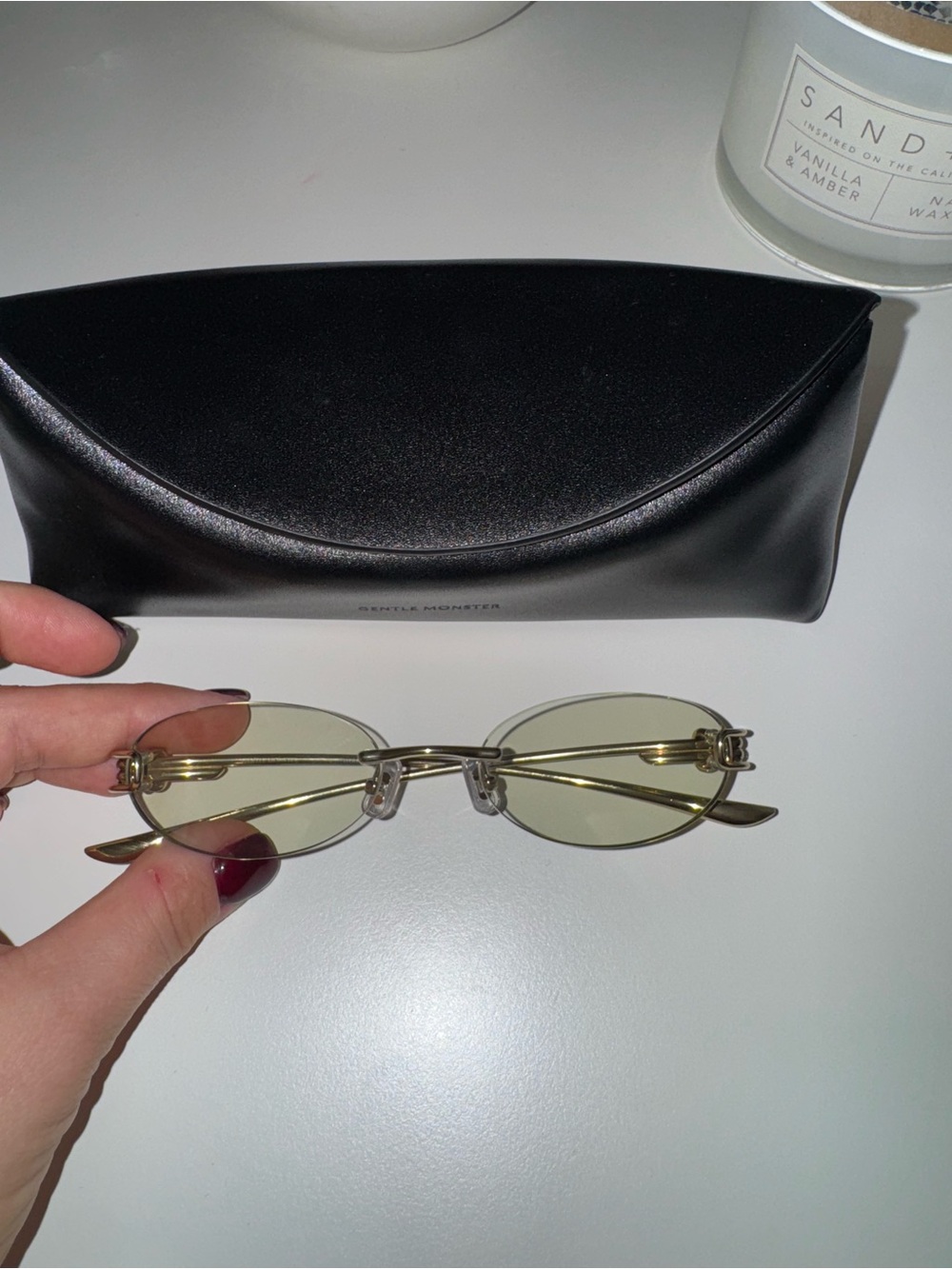 GENTLE MONSTER Gold Rim Oval Sunglasses with Light Yellow Lenses
